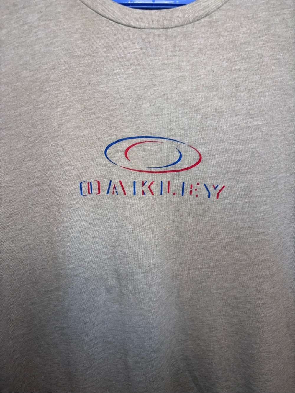 Oakley Light Gray Short Sleeve Logo Tee with Blue & Red Accents - Picture 2 of 4